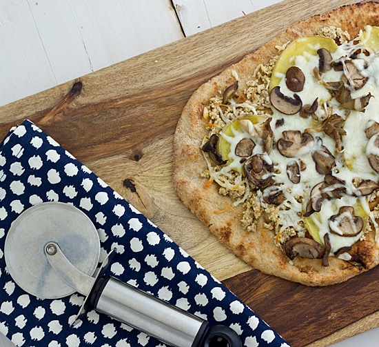 Wild Mushroom & Potato Pizza on cutting board Wild Mushroom & Potato Pizza on cutting board