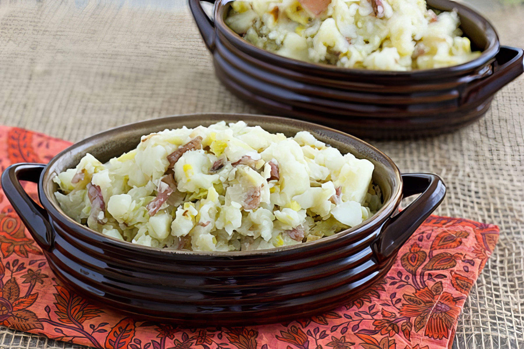 mashed red potatoes with leeks being served