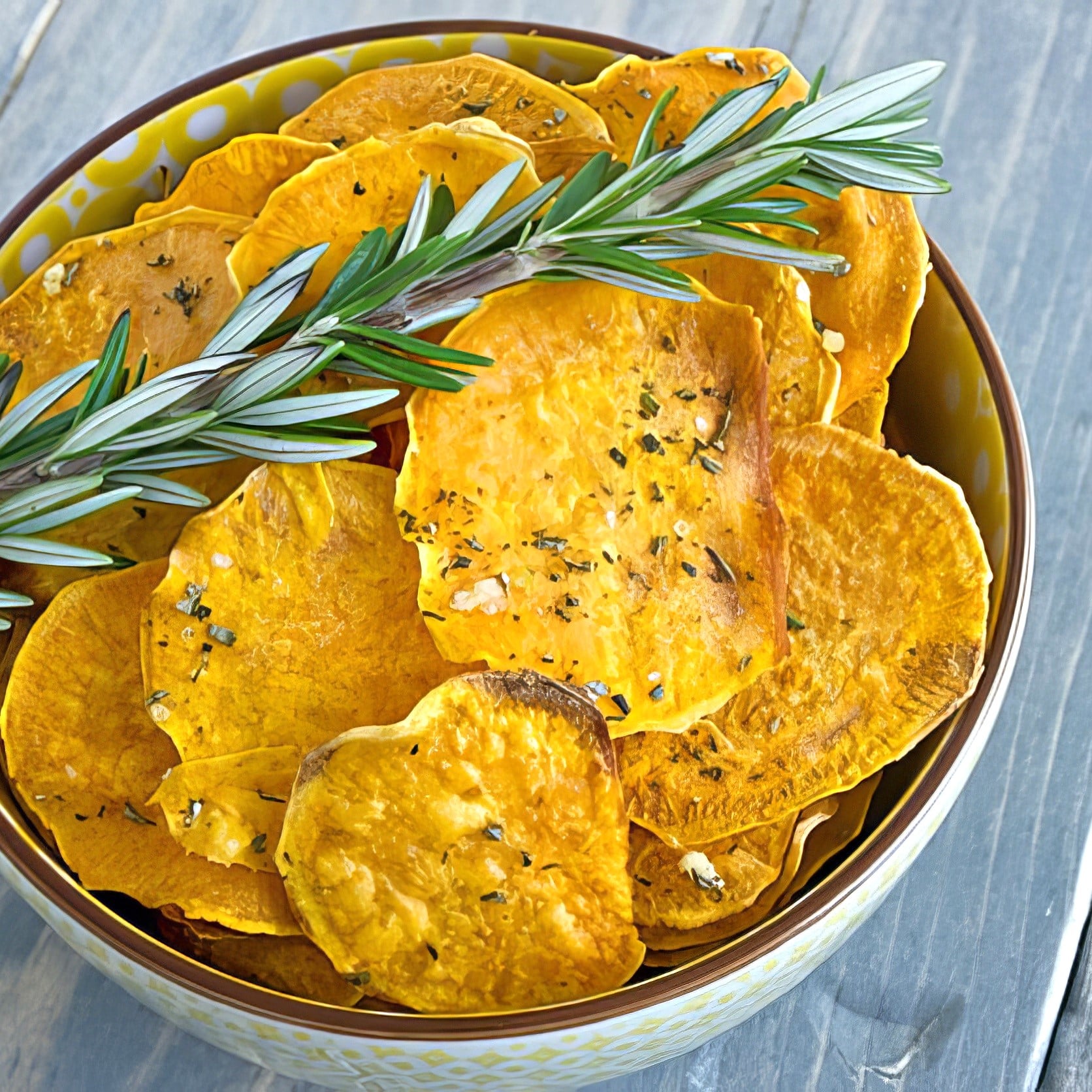 baked sweet potato chips with olive oil, garlic and rosemary