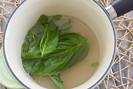 Basil Simple Syrup in Saucepan being made