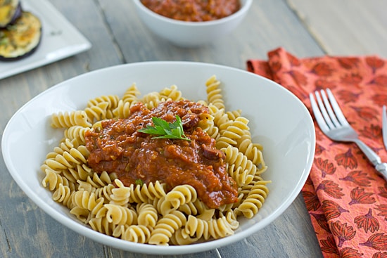 Roasted Vegetarian Puttanesca being served over Pasta