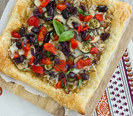 Caramelized Onion & Eggplant Puff Pastry Tart with Kalamata Olives, Roasted Red Peppers & Basil