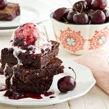 Cherry Lambic Brownies sitting on white plate