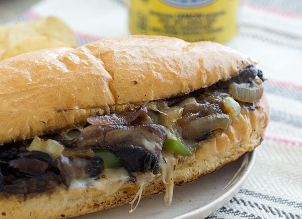 Portobello Cheesesteak sandwich closeup on a white plate