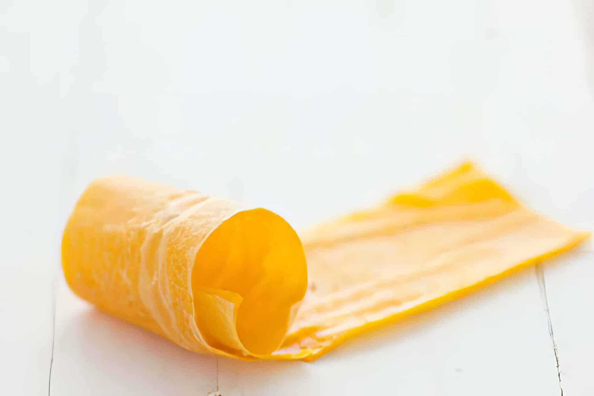 homemade mango fruit leather on a white table