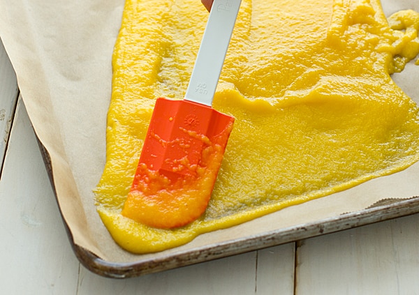 Spreading Mango Puree onto Baking Sheet