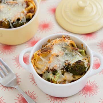 Cheese Tortellini Bake with Roasted Broccoli in white pot with fork