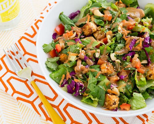https://ohmyveggies.com/wp-content/uploads/2014/02/chopped_power_salad_with_baked_tofu_and_almond_miso_dressing_recipe-500x403.jpg