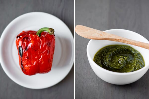 a roasted red pepper on a plate & green pesto in a bowl for making Roasted Red Pepper and Arugula Pesto