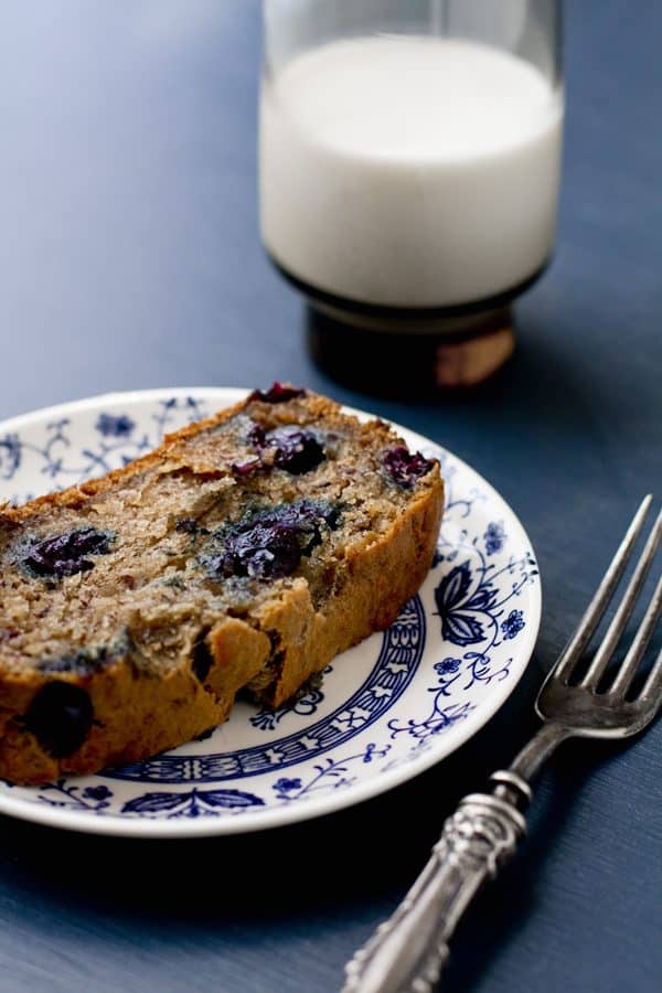 Vegan Blueberry Banana Bread on a blue and white plate