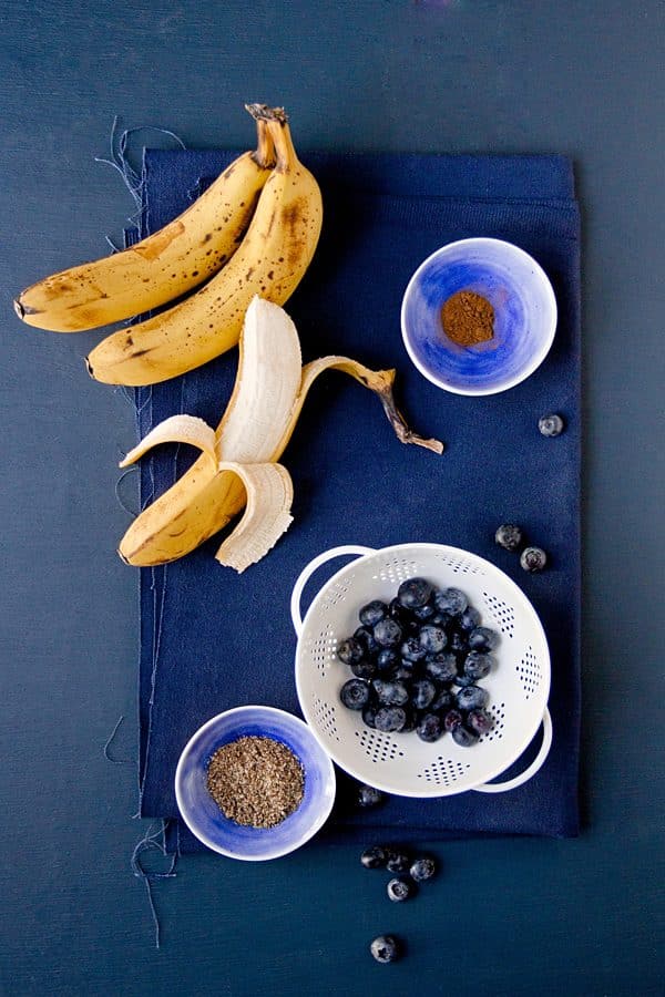 Vegan Blueberry Banana Bread Ingredients on a blue table