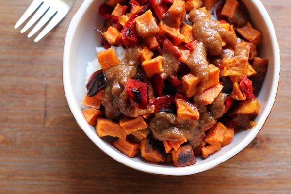 spicy thai peanut sauce over roasted sweet potatoes and rice