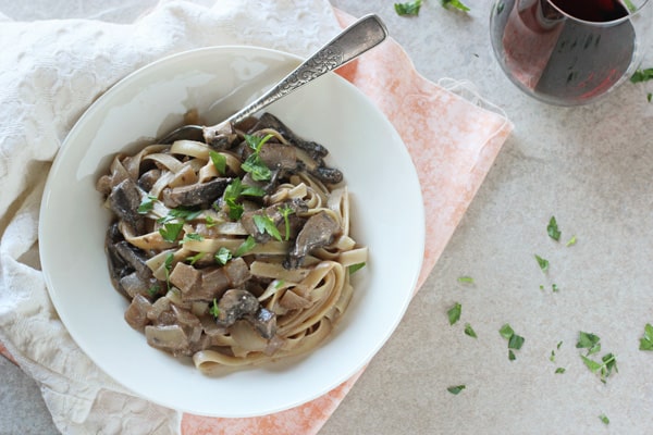 Portabella Stroganoff in white plate on a table