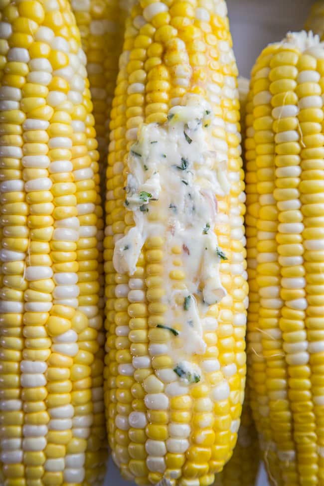 corn on the cob slathered in herbed compound butter