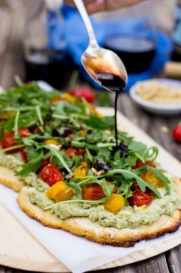 Basil and Roasted Garlic Ricotta Pizza with Arugula-Balsamic Reduction