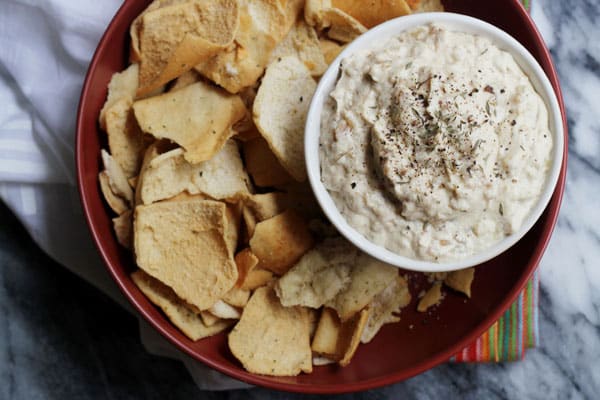 vegan french onion dip being served with pita chips