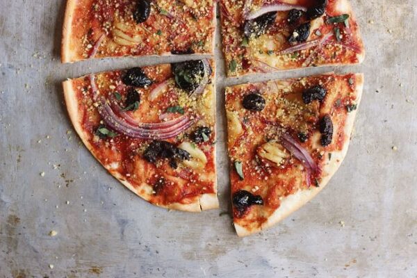 Oil-Cured Olive and Smashed Garlic Pizza with Herby Oregano 'Parm'
