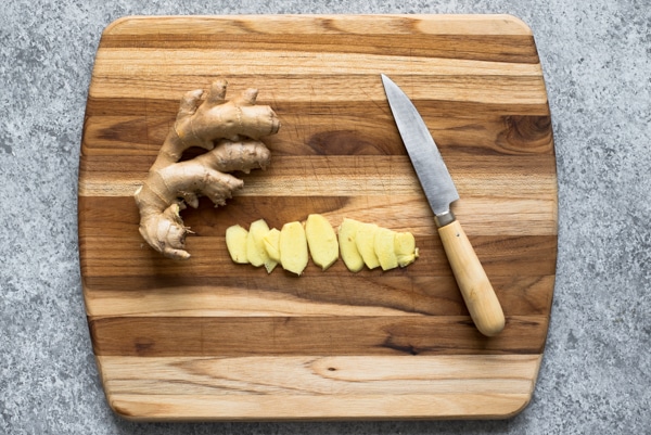 chopping ginger and garlic for One-Pot Curry Noodles