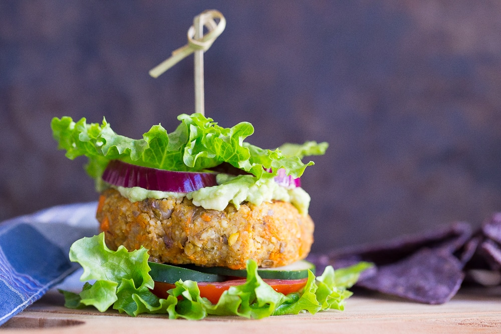 These Millet, Sweet Potato and Lentil Veggie Burgers are a delicious, healthy and light meal that are only about 400 calories each! Enjoy in a lettuce wrap for a filling meal that won't leave you feeling heavy!