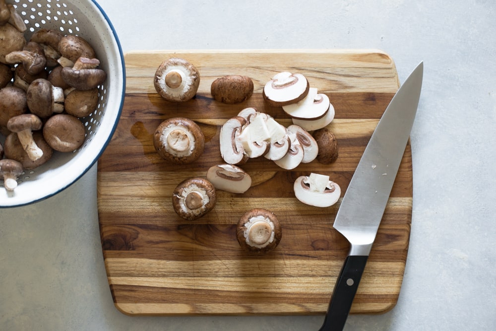 chopping mushrooms for the Mushroom Barley Pilaf