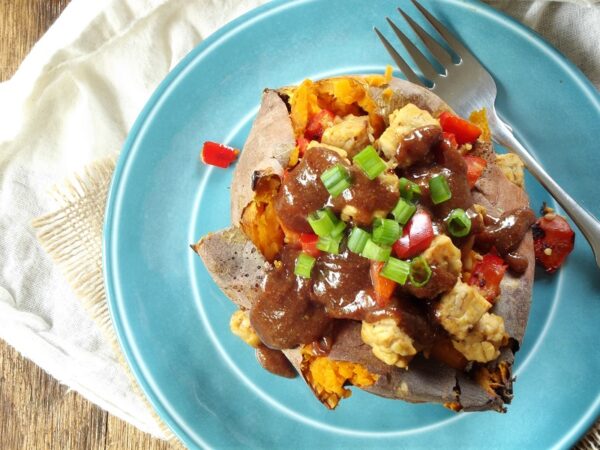 Ginger Tempeh Stuffed Sweet Potatoes with Almond Butter Sauce
