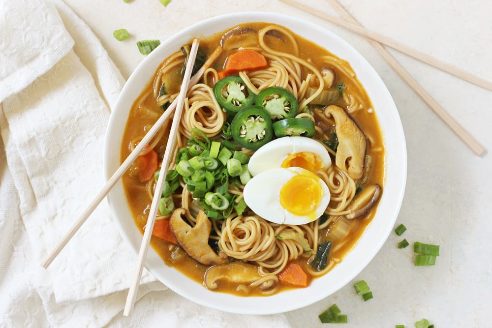 colorful veggie ramen bowl with chopsticks