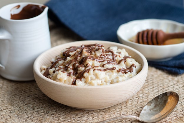 15 Creamy & Dreamy Rice Pudding Recipes: Eggnog Rice Pudding with Chocolate Drizzle