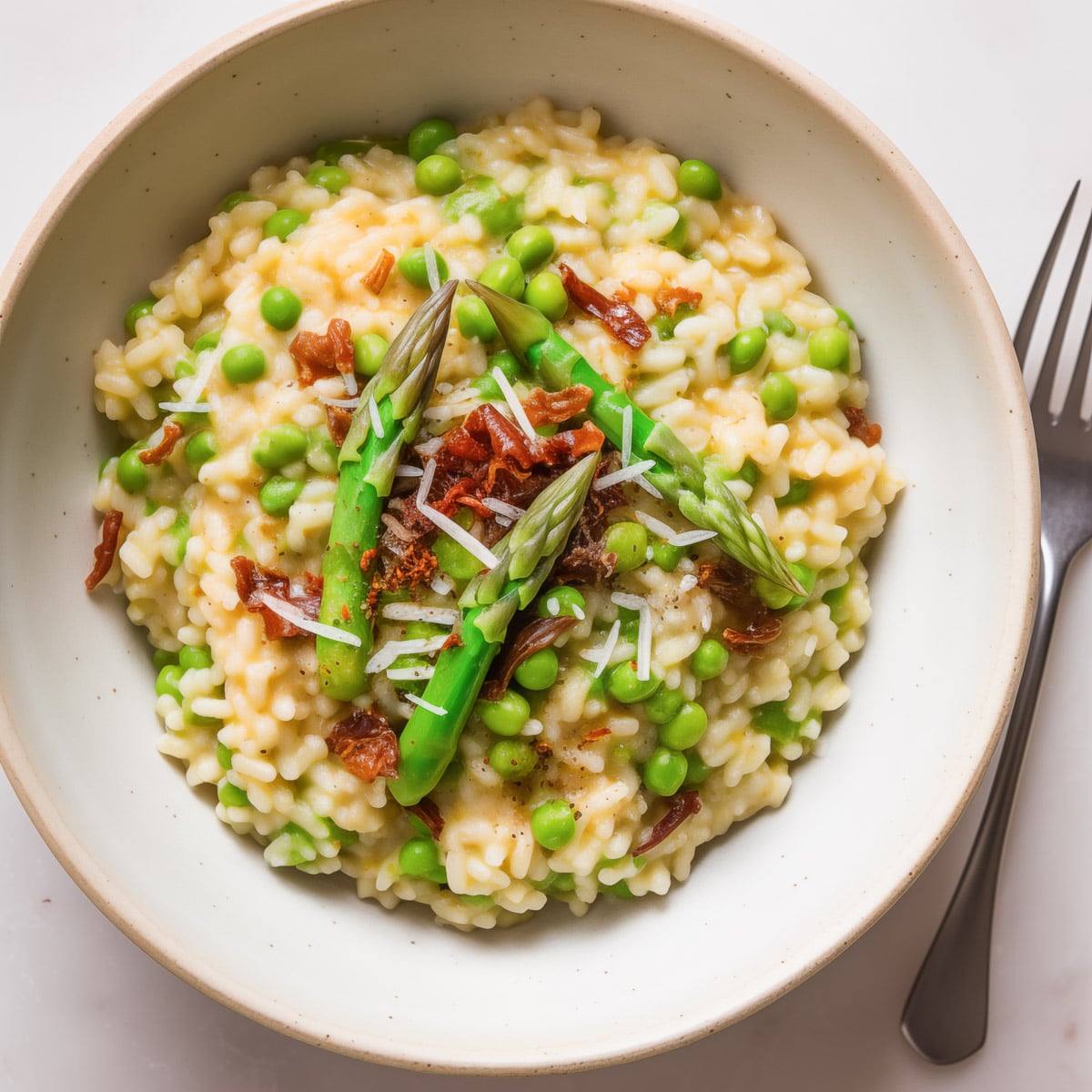 spring veggie risotto being served in a bowl
