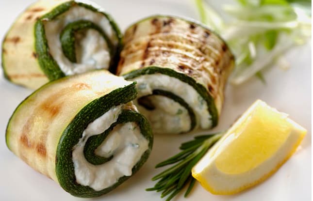 Grilled zucchini rolled up with ricotta herb paste