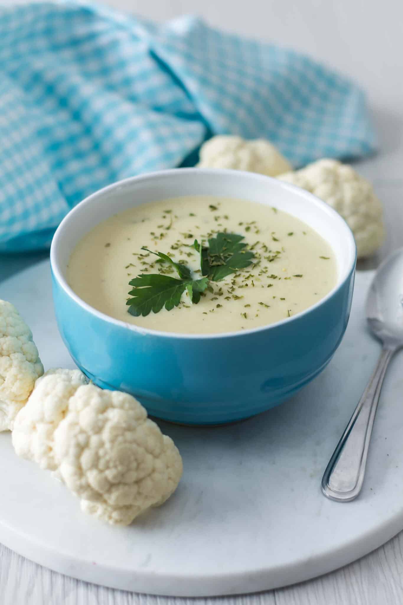 cream of cauliflower soup in a blue bowl