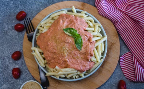pasta with vodka sauce being served in a bowl