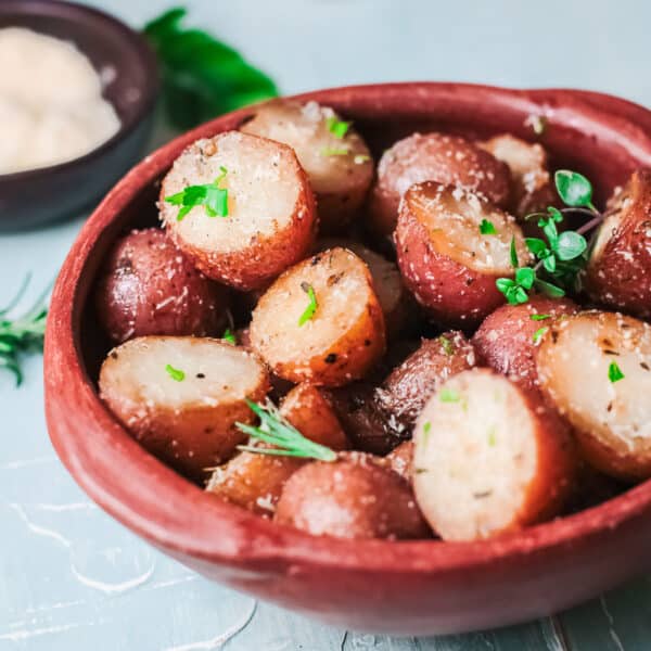 Roasted Potatoes in a red serving bowl