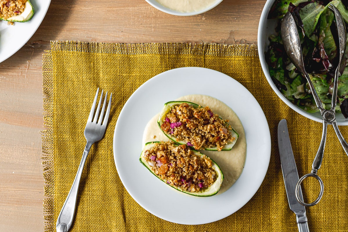 served healthy stuffed zucchini on wooden table