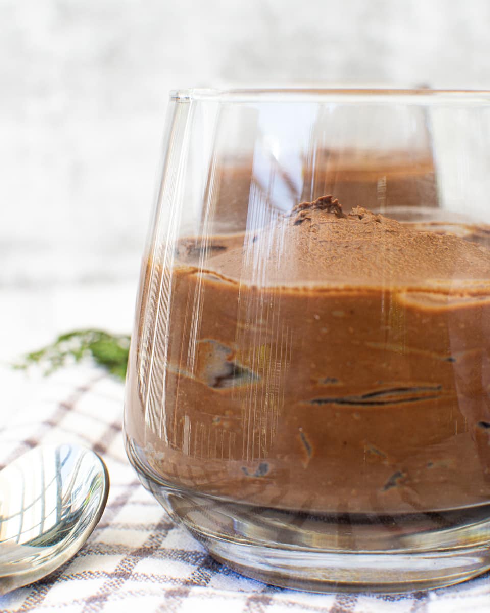 side view of a glass of vegan chocolate avocado mousse