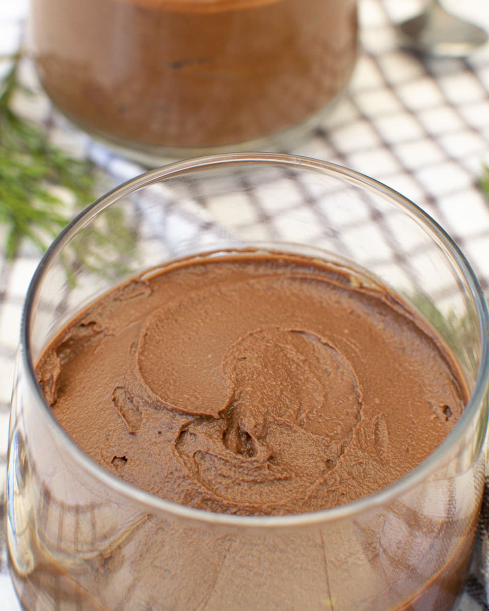 close up of a glass of vegan chocolate avocado mousse