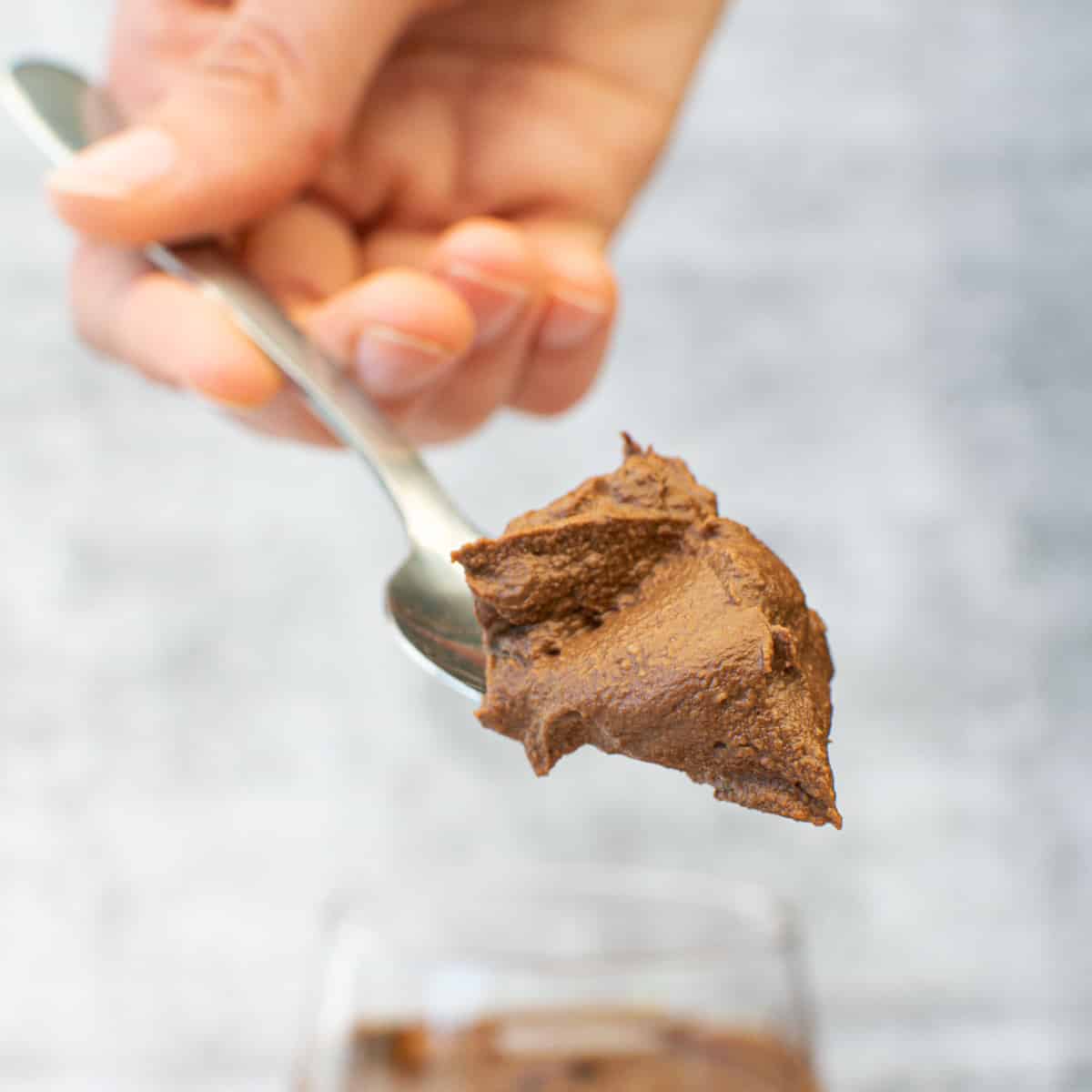 close up spoonful of vegan chocolate avocado mousse