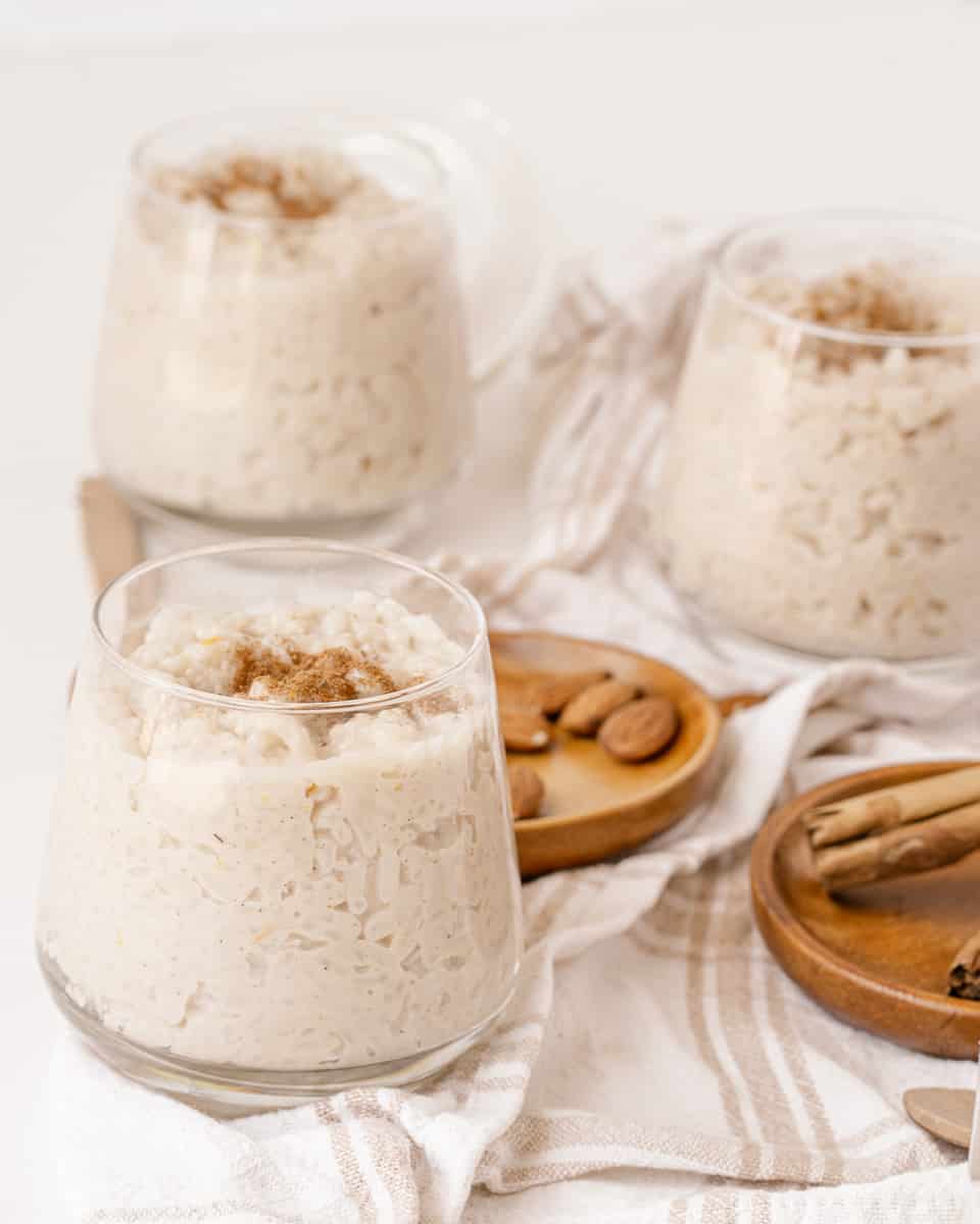 Vegan Rice Pudding being served in a glass