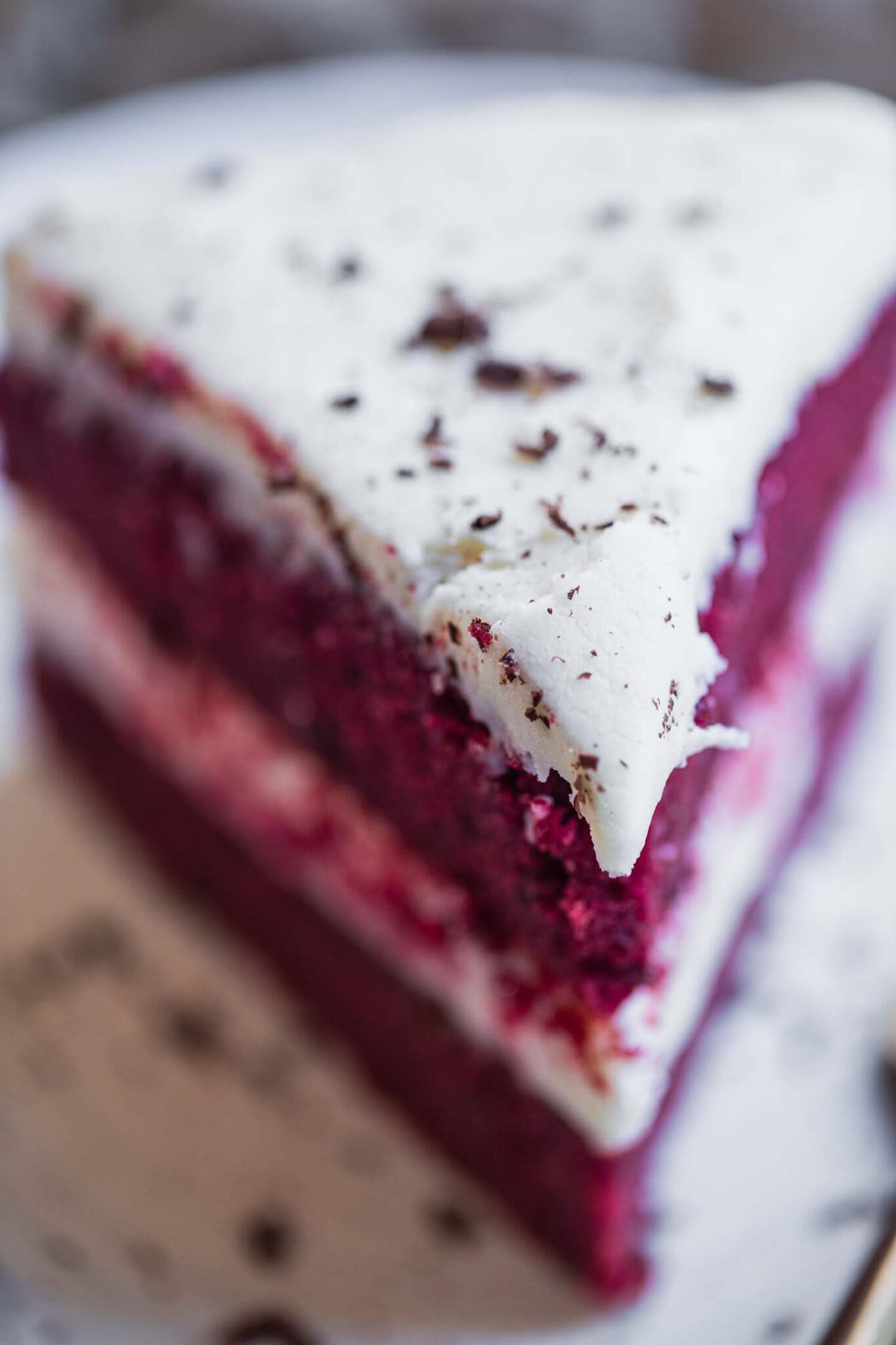 close up of a slice of vegan red velvet cake