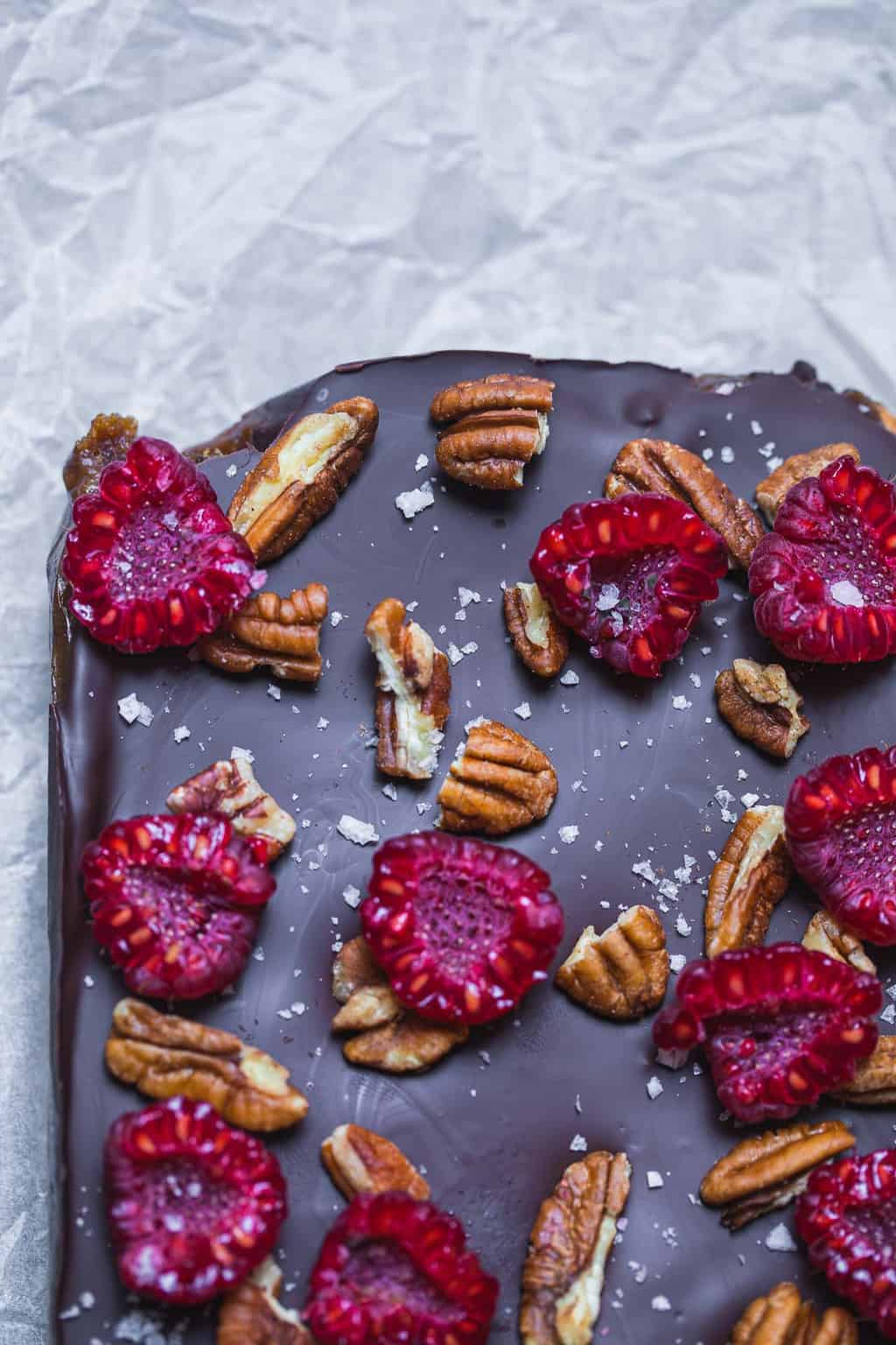 vegan millionaire shortbread topped with berries and nuts