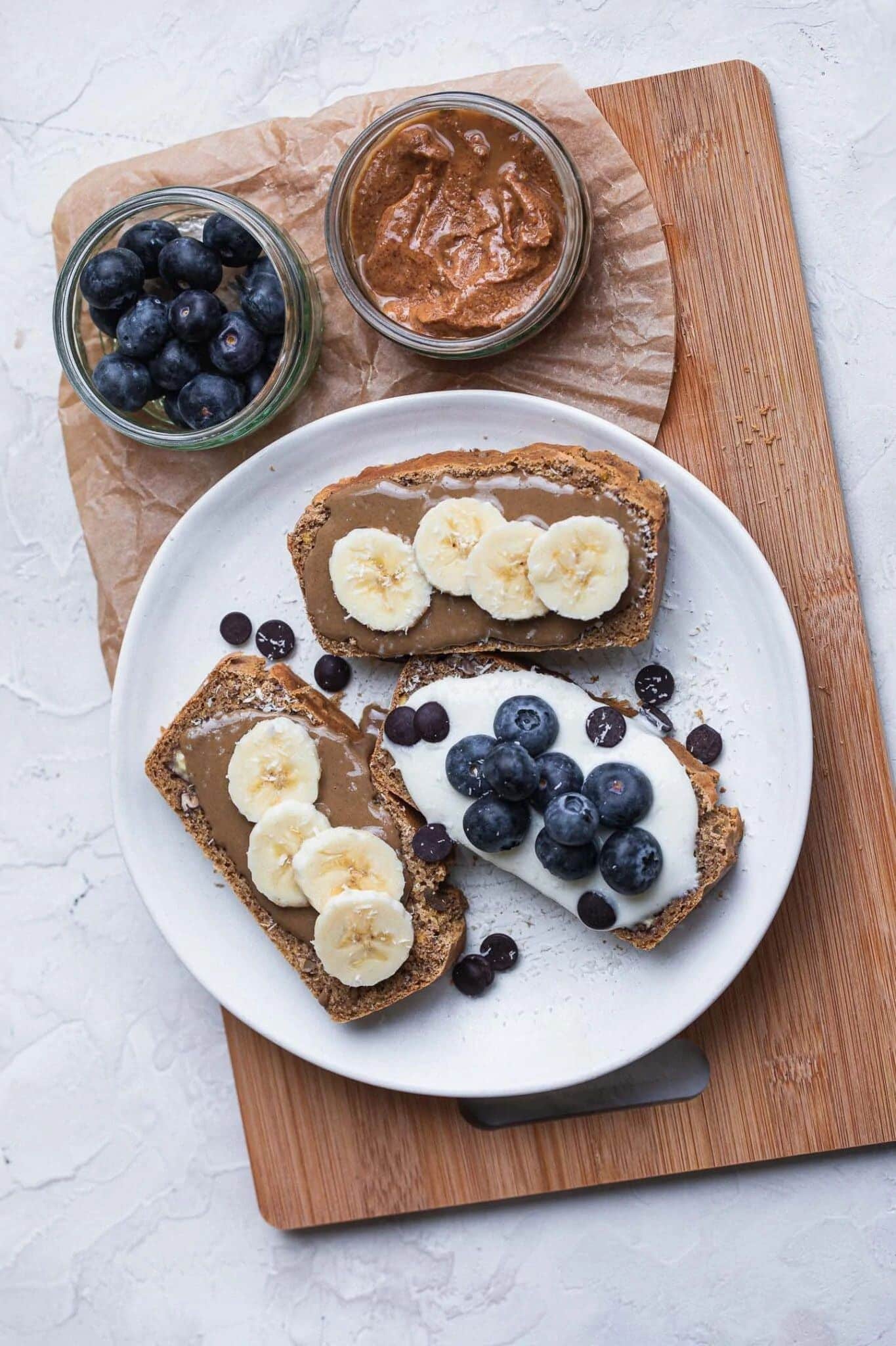 pecan bread topped with peanut butter and fruit