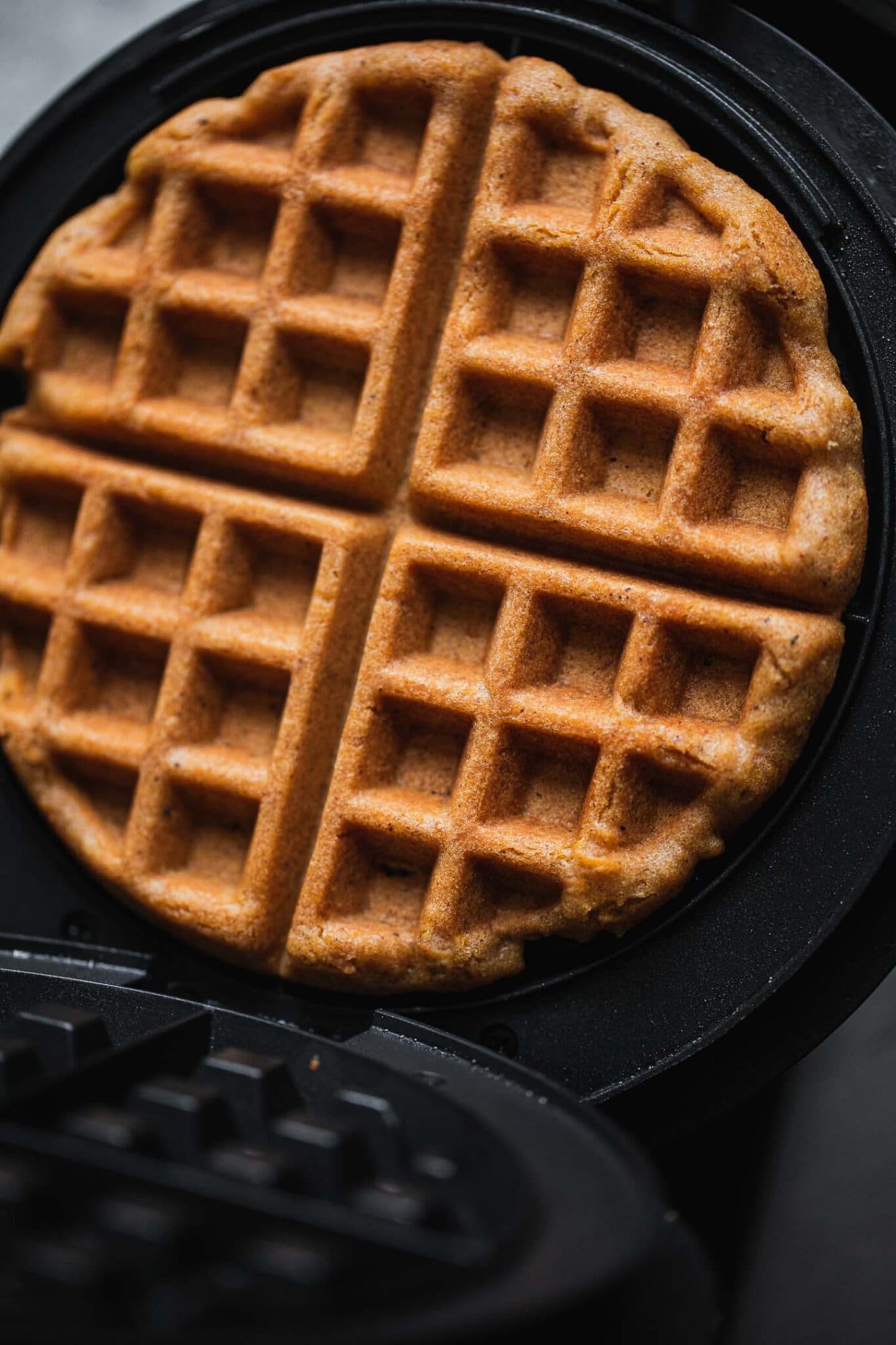 cooking waffles in the waffle iron
