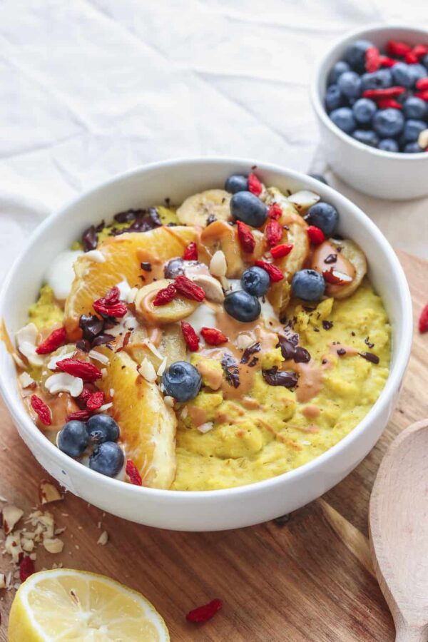 vegan oatmeal topped with fruit in a bowl