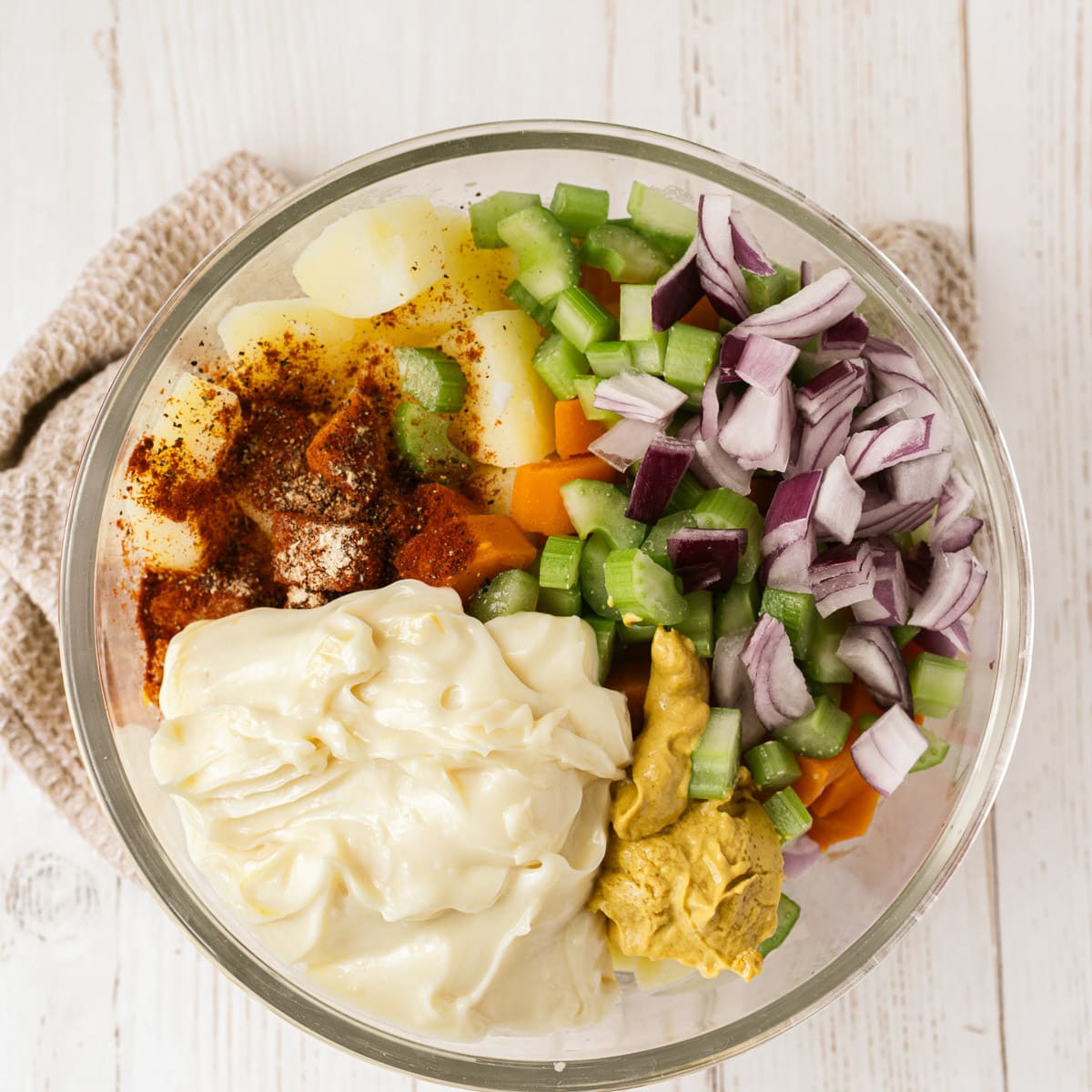 ingredients for vegan potato salad in bowl together