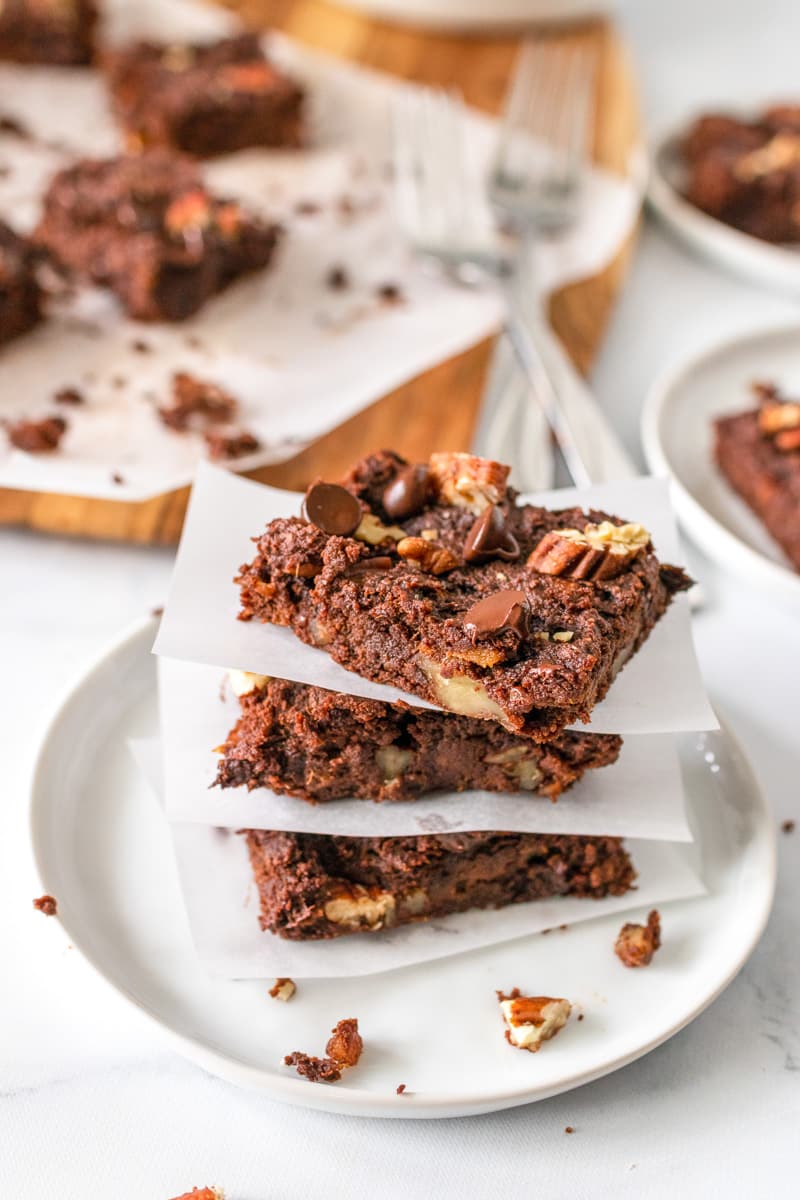 stack of sweet potato brownies with tray in back