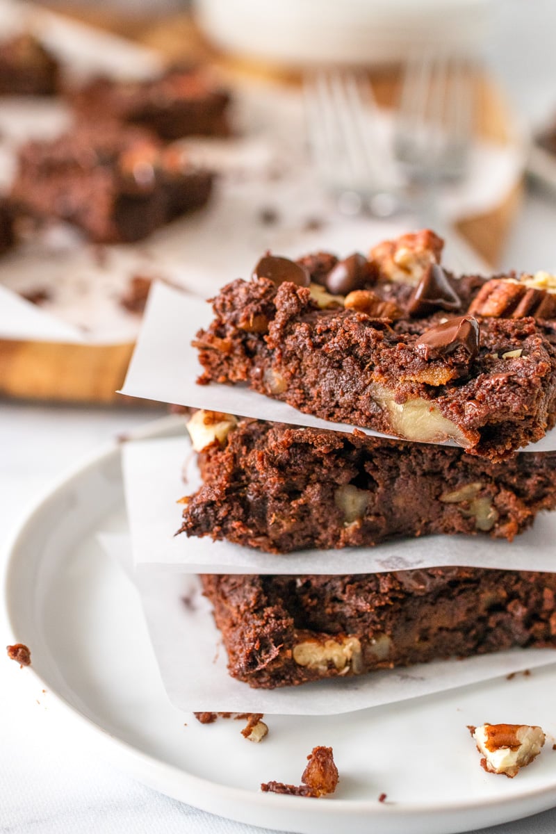 sweet potato brownies stacked on baking paper