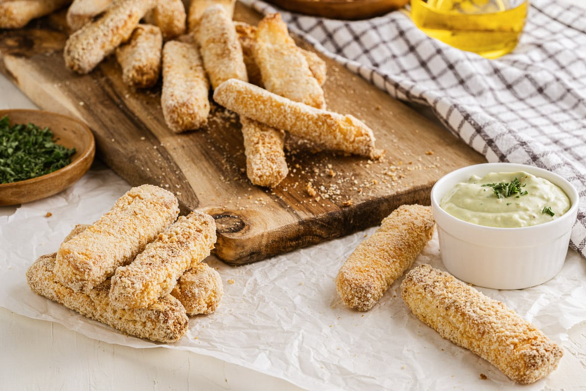 stacks of fried halloumi on a cutting board