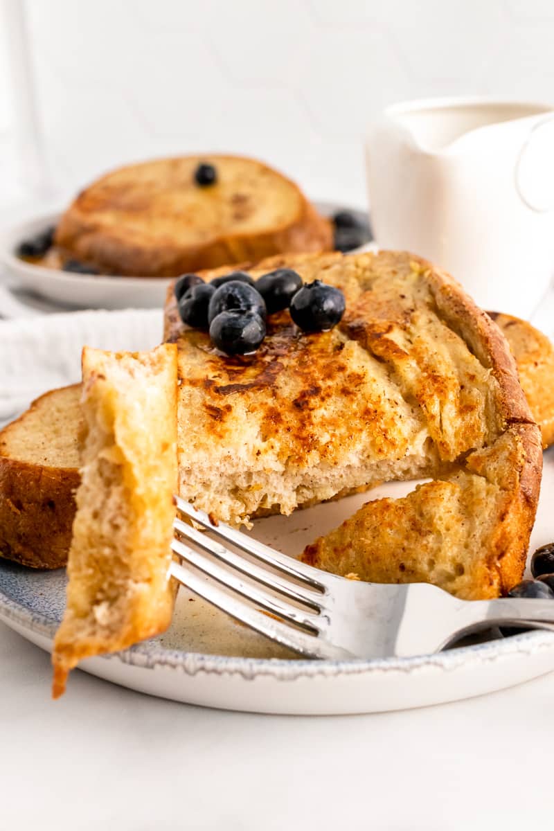 bite of sourdough French toast on a fork