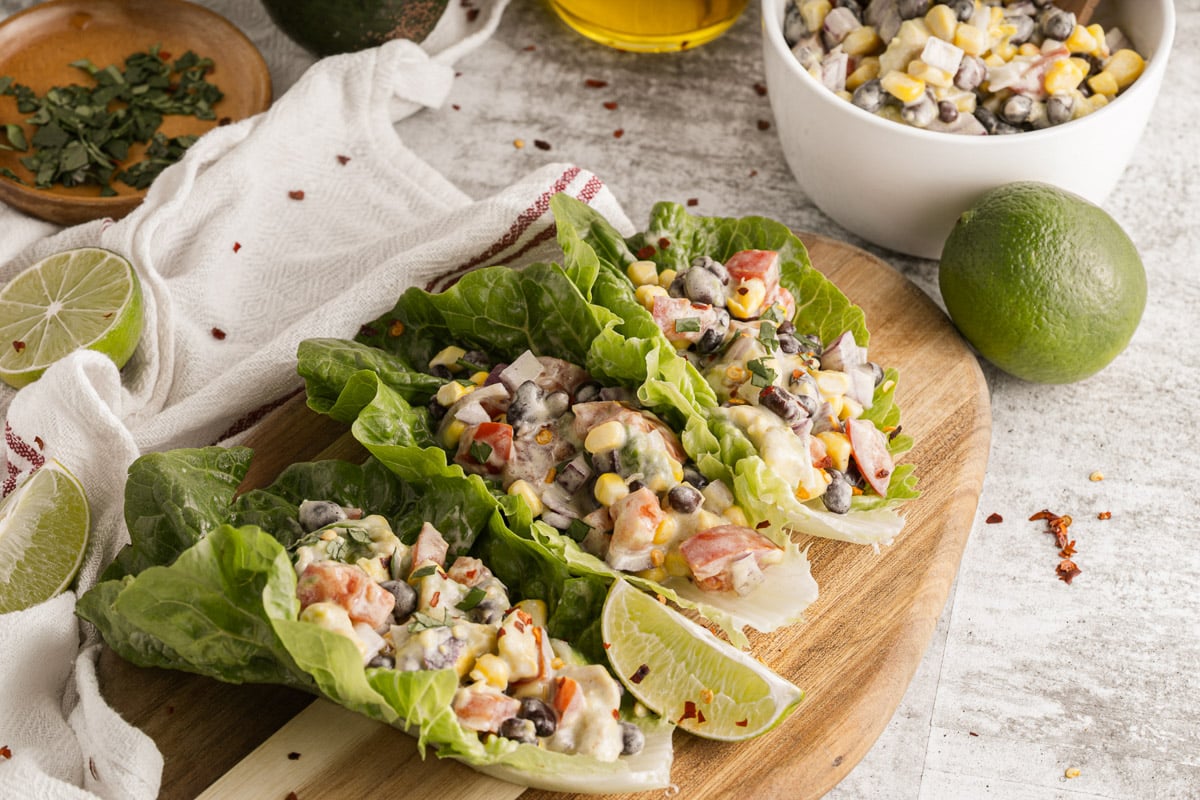 black bean lettuce wraps on a wooden tray