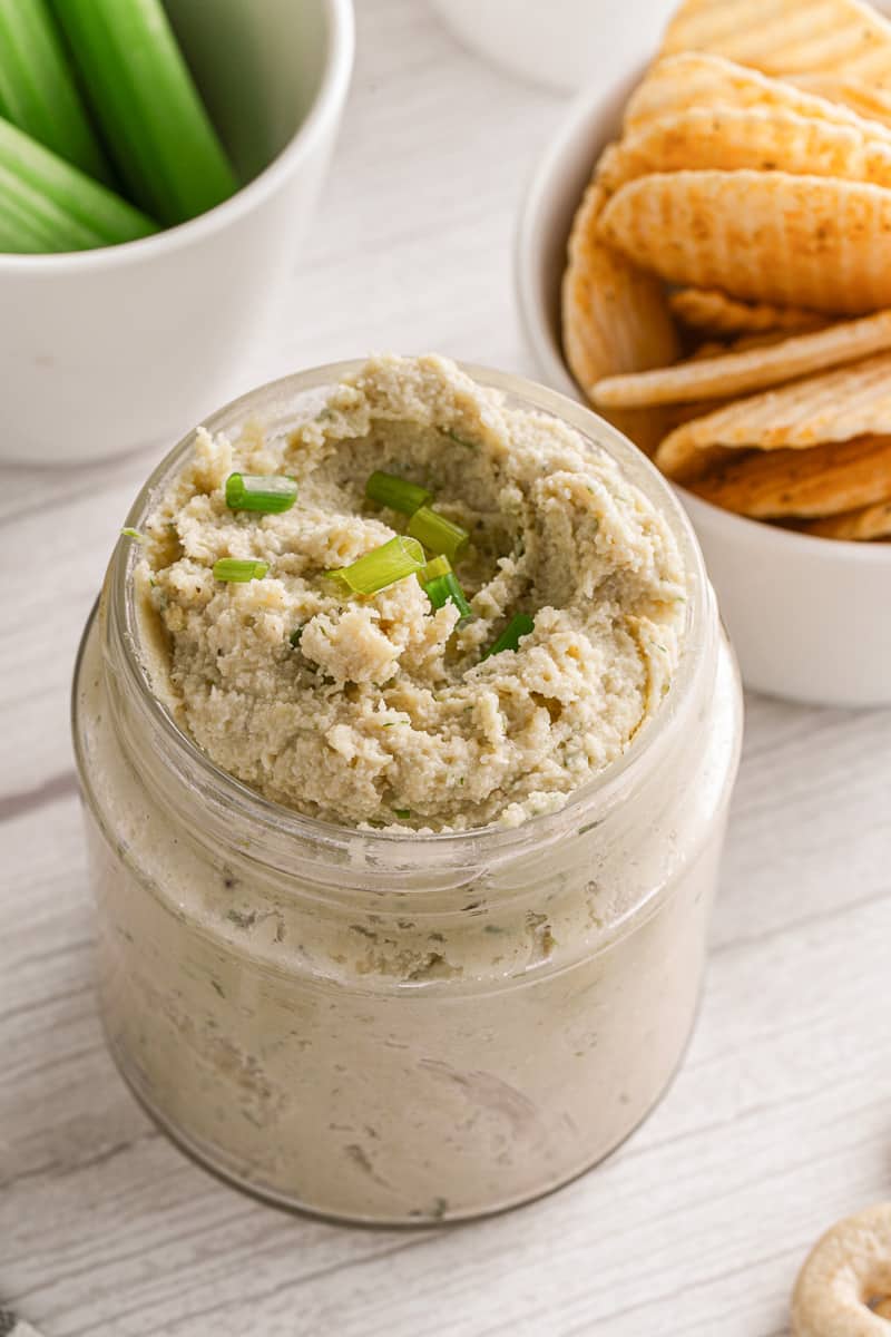 15-minute cashew cheese in a jar topped with chives
