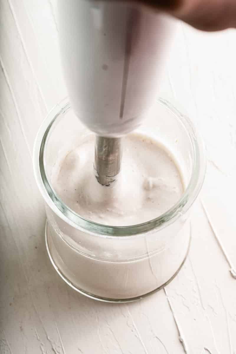 immersion blender in a jar of easy vegan mayo